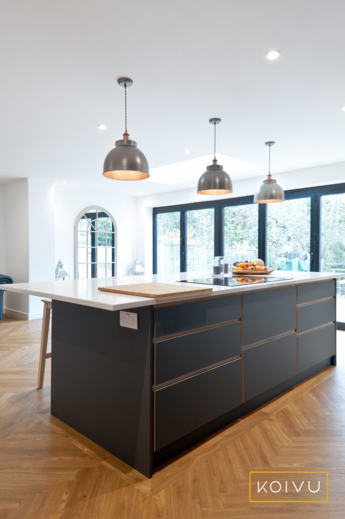 Large island - centrepiece of kitchen in Tonbridge. Storage has been maximised using draw packs. Designed by Koivu.