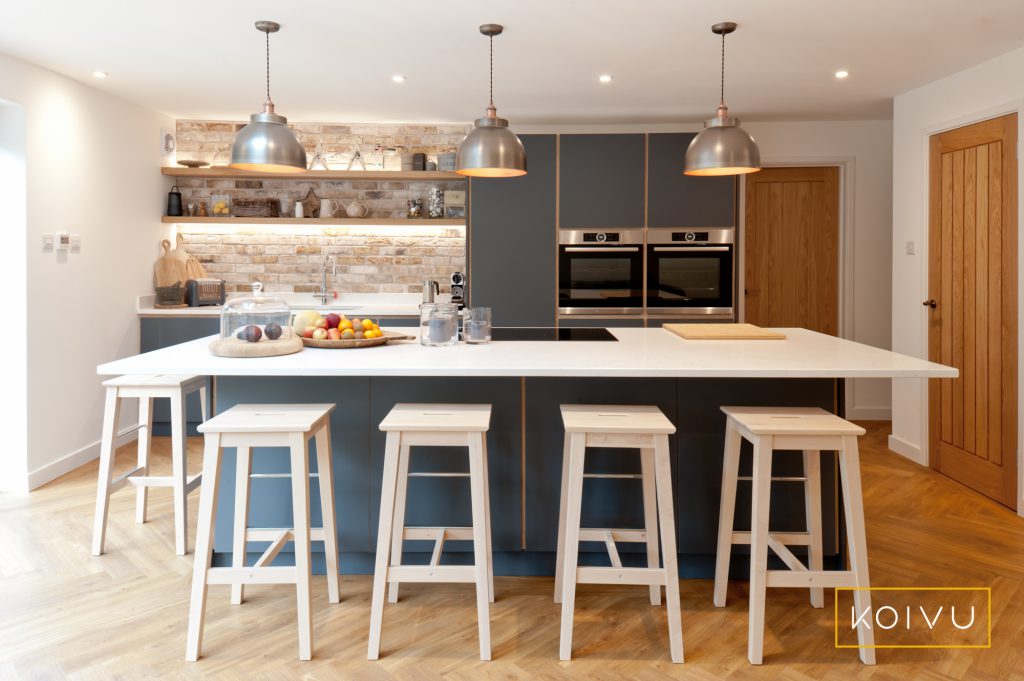 Beautiful dark grey kitchen in Tonbridge with large island and breakfast bar with 5 stools. Designed by Koivu.