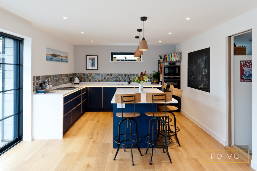 L-shaped new build kitchen with island and breakfast bar. By Koivu.