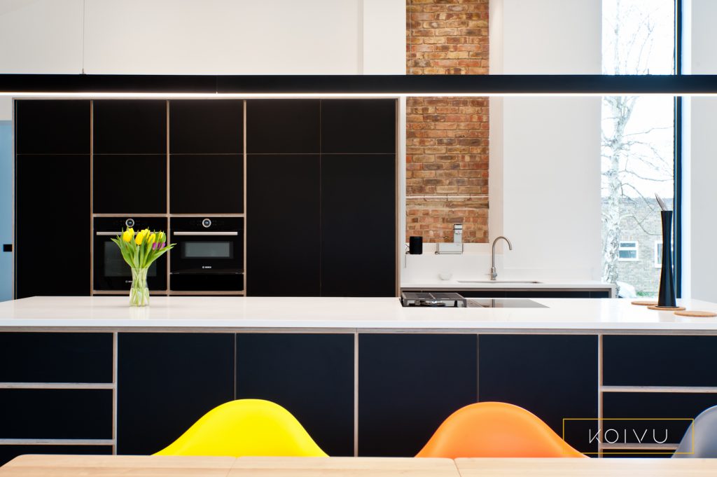 A black plywood kitchen fitted in Leatherhead by Koivu. This image shows off the clean lines of a Koivu kitchen.