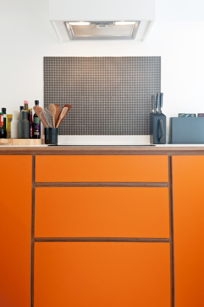 Hob with drawers under in orange kitchen