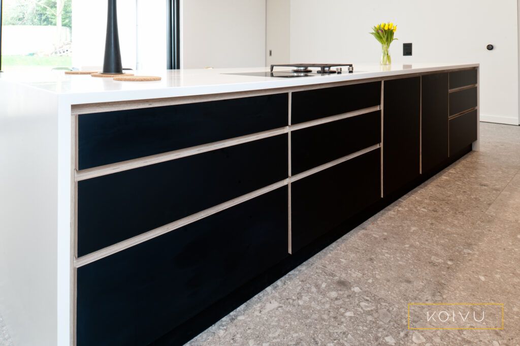 Black birch plywood island with white countertop. Bespoke design by Koivu Kitchens.