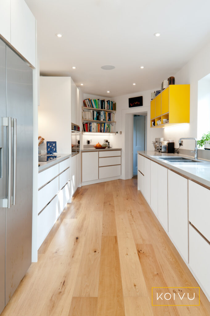 A white and yellow kitchen in Tunbridge Wells. By Koivu Kitchens
