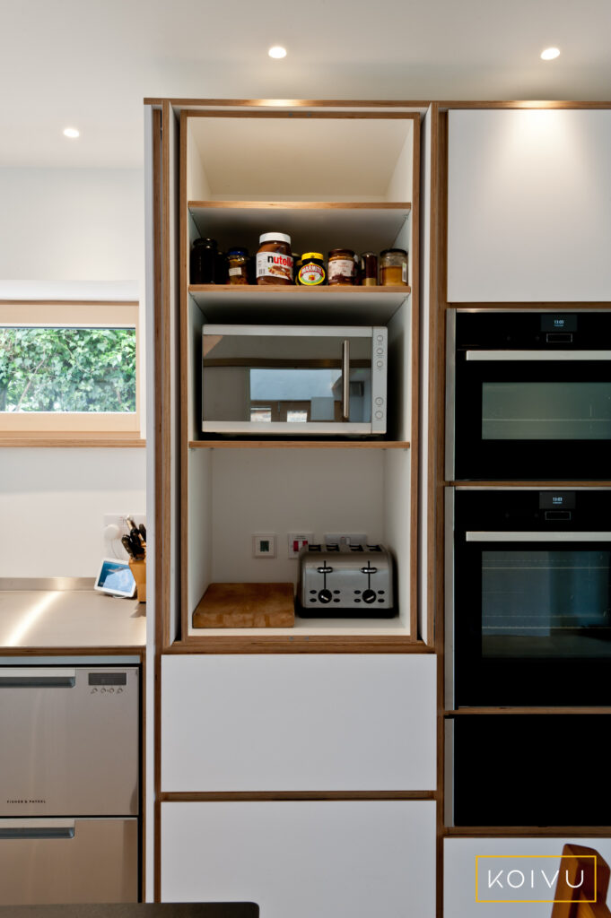 Open butler's cupboard in a white plywood kitchen