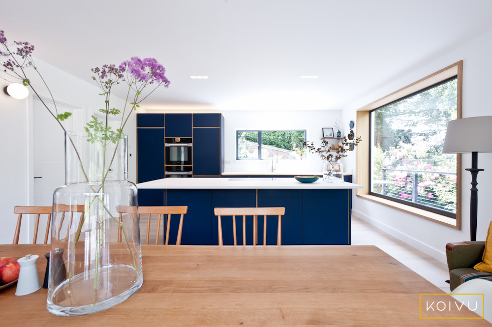 Dark blue kitchen with open plan layout