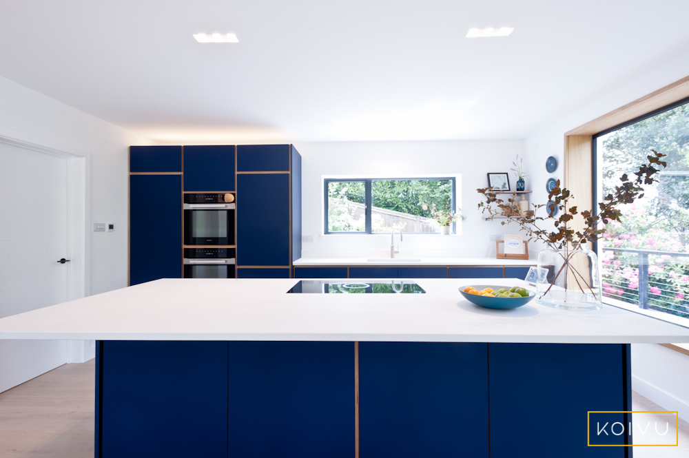 How to maintain the beauty of your birch plywood kitchen - a pristinely clean blue and white Koivu kitchen.