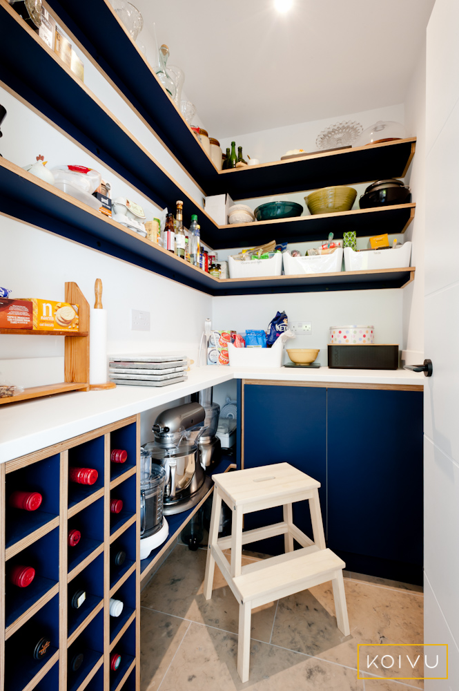 Hidden pantry cupboard. Bespoke design. Navy blue plywood.