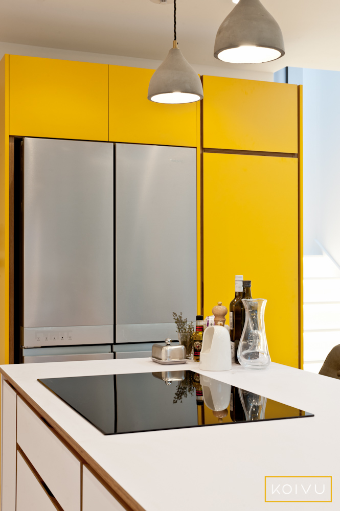 plywood island hob and yellow larder. Designed by Koivu.