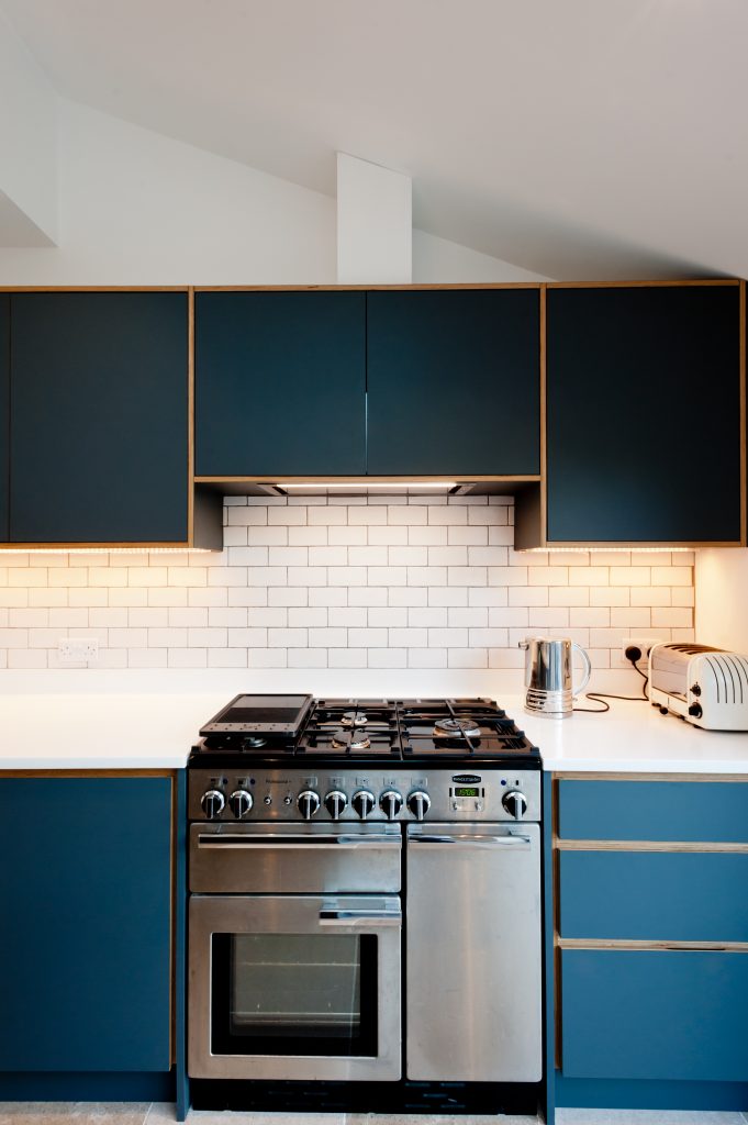 Dark grey kitchen with freestanding range cooker.