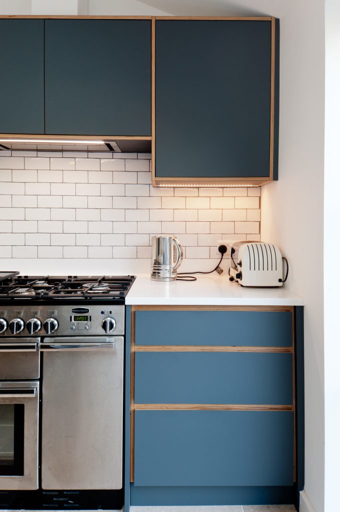 Clean lines of drawers and edges in plywood kitchen.